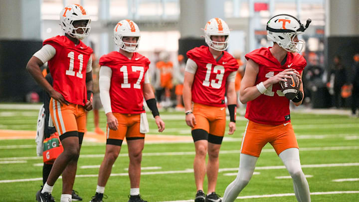 Tennessee quarterbacks, from left, Faizon Brandon (11), Ryan Staub (17), Mason Phillips (13) and George MacIntyre (15) during the Vols' first spring football practice in Knoxville on March 16, 2026.