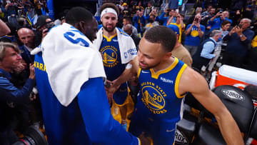 Mar 14, 2022; San Francisco, California, USA; Golden State Warriors forward Draymond Green celebrates with guards Klay Thompson and Stephen Curry.
