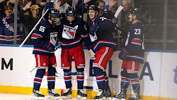 Nov 3, 2024; New York, New York, USA; New York Rangers left wing Chris Kreider (20) celebrates his short-handed goal against the New York Islanders with defenseman Ryan Lindgren (55), center Mika Zibanejad (93) and defenseman Adam Fox (23) during the first period at Madison Square Garden.