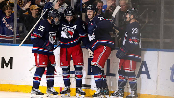 Nov 3, 2024; New York, New York, USA; New York Rangers left wing Chris Kreider (20) celebrates his short-handed goal against the New York Islanders with defenseman Ryan Lindgren (55), center Mika Zibanejad (93) and defenseman Adam Fox (23) during the first period at Madison Square Garden.