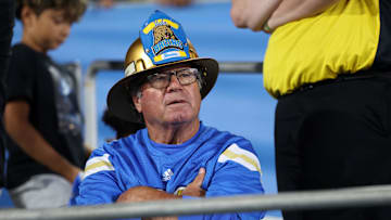 An UCLA Bruins fan looks on during the second half against the New Mexico Lobos at Rose Bowl. Mandatory Credit: Kiyoshi Mio-Imagn Images