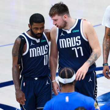 Jun 14, 2024; Dallas, Texas, USA; Dallas Mavericks guard Kyrie Irving (11) reacts with Dallas Mavericks guard Luka Doncic (77) during the second half against the Boston Celtics during game four of the 2024 NBA Finals at American Airlines Center. Mandatory Credit: Kevin Jairaj-USA TODAY Sports