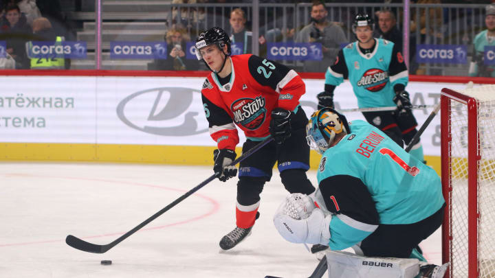 Div. Bobrova Hockey Club player, Mikhail Berdine (1) and Div...