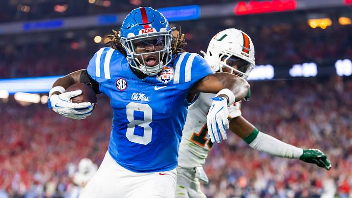 Jan 8, 2026; Glendale, AZ, USA; Mississippi Rebels tight end Dae'Quan Wright (8) scores a touchdown against the Miami Hurricanes during the 2026 Fiesta Bowl and semifinal game of the College Football Playoff at State Farm Stadium. Mandatory Credit: Mark J. Rebilas-Imagn Images