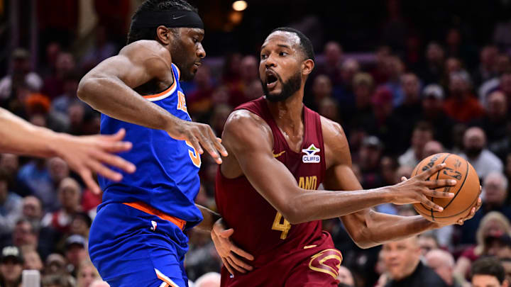 Apr 2, 2025; Cleveland, Ohio, USA; Cleveland Cavaliers forward Evan Mobley (4) drives to the basket against New York Knicks forward Precious Achiuwa (5) during the second half at Rocket Arena. Mandatory Credit: Ken Blaze-Imagn Images Apr 2, 2025; Cleveland, Ohio, USA; Cleveland Cavaliers forward Evan Mobley (4) drives to the basket against New York Knicks forward Precious Achiuwa (5) during the second half at Rocket Arena. Mandatory Credit: Ken Blaze-Imagn Images