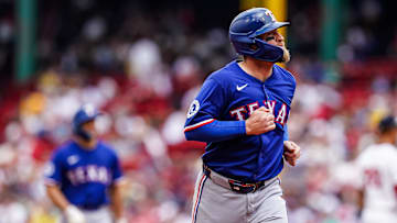 May 8, 2025; Boston, Massachusetts, USA; Texas Rangers catcher Tucker Barnhart (18) tagged out against the Boston Red Sox in the third inning at Fenway Park. Mandatory Credit: David Butler II-Imagn Images