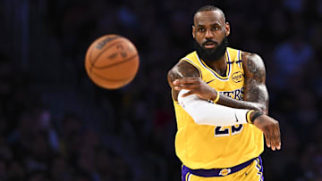 Apr 11, 2025; Los Angeles, California, USA; Los Angeles Lakers forward LeBron James (23) passes against the Houston Rockets during the first half at Crypto.com Arena. Mandatory Credit: Jonathan Hui-Imagn Images
