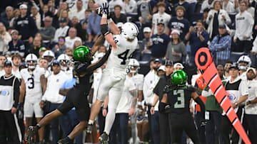 Dec 7, 2024; Indianapolis, IN, USA; Penn State Nittany Lions tight end Tyler Warren (44) catches a pass over the head of Oregon Ducks linebacker Devon Jackson (26) during the third quarter in the 2024 Big Ten Championship game at Lucas Oil Stadium. Mandatory Credit: Robert Goddin-Imagn Images