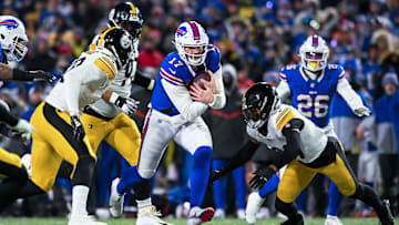 Buffalo Bills QB Josh Allen runs the ball against the Pittsburgh Steelers in the fourth quarter of a 2024 AFC wild-card game.