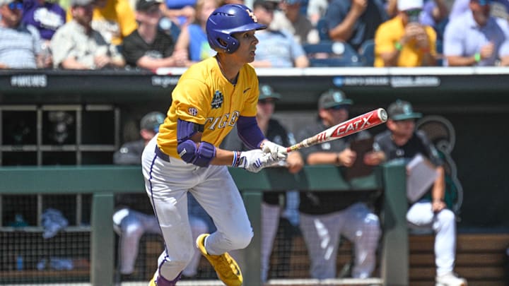 Jun 22, 2025; Omaha, Neb, USA;  LSU Tigers left fielder Derek Curiel (6) drives in two runs with a single against the Coastal Carolina Chanticleers during the fourth inning at Charles Schwab Field. Mandatory Credit: Steven Branscombe-Imagn Images