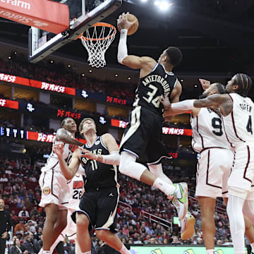 Feb 25, 2025; Houston, Texas, USA; Milwaukee Bucks forward Giannis Antetokounmpo (34) attempts to control the ball during the fourth quarter against the Houston Rockets at Toyota Center. Mandatory Credit: Troy Taormina-Imagn Images