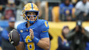 Nov 15, 2025; Pittsburgh, Pennsylvania, USA;  Pittsburgh Panthers quarterback Mason Heintschel (6) looks to pass against the Notre Dame Fighting Irish during the first quarter at Acrisure Stadium. Mandatory Credit: Charles LeClaire-Imagn Images