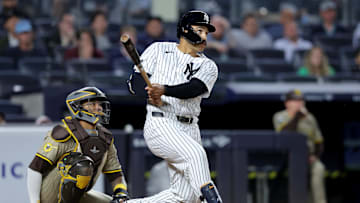 May 7, 2025; Bronx, New York, USA; New York Yankees pinch hitter Trent Grisham (12) follows through on a game tying two run home run against the San Diego Padres during the eighth inning at Yankee Stadium. Mandatory Credit: Brad Penner-Imagn Images