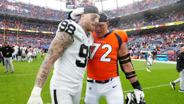 Sep 10, 2023; Denver, Colorado, USA; Denver Broncos offensive tackle Garett Bolles (72) and Las Vegas Raiders defensive end Maxx Crosby (98) following the game at Empower Field at Mile High. Mandatory Credit: Ron Chenoy-USA TODAY Sports