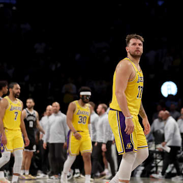 Mar 10, 2025; Brooklyn, New York, USA; Los Angeles Lakers guard Luka Doncic (77) reacts during the fourth quarter against the Brooklyn Nets at Barclays Center. Mandatory Credit: Brad Penner-Imagn Images