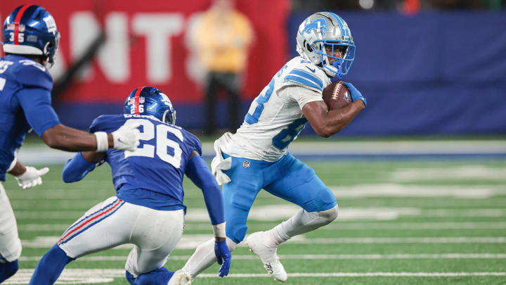 Aug 8, 2024; East Rutherford, New Jersey, USA; Detroit Lions wide receiver Isaiah Williams (83) gains yards after catch as New York Giants cornerback Breon Borders (26) pursues during the second half at MetLife Stadium. Mandatory Credit: Vincent Carchietta-USA TODAY Sports