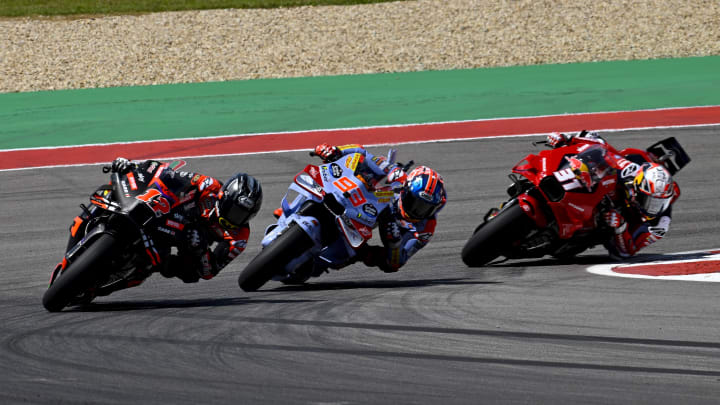 Apr 13, 2024; Austin, TX, USA; Maverick Vinales (12) of Spain and Aprilia Racing and Marc Marquez (93) of Spain and Gresini Racing MotoGP and Pedro Acosta (31) of Spain and Red Bull Tech3 GASGAS during the Americas Grand Prix sprint race at Circuit of The Americas. Mandatory Credit: Jerome Miron-USA TODAY Sports