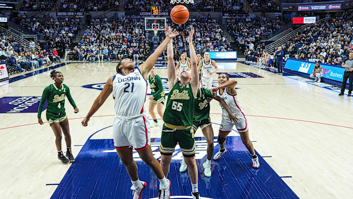 Nov 10, 2024; Storrs, Connecticut, USA; UConn Huskies forward Sarah Strong (21) and South Florida Bulls guard Carla Brito (55) work for the ball in the first half at Harry A. Gampel Pavilion. Mandatory Credit: David Butler II-Imagn Images Nov 10, 2024; Storrs, Connecticut, USA; UConn Huskies forward Sarah Strong (21) and South Florida Bulls guard Carla Brito (55) work for the ball in the first half at Harry A. Gampel Pavilion. Mandatory Credit: David Butler II-Imagn Images