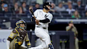 May 7, 2025; Bronx, New York, USA; New York Yankees pinch hitter Trent Grisham (12) follows through on a game tying two run home run against the San Diego Padres during the eighth inning at Yankee Stadium. Mandatory Credit: Brad Penner-Imagn Images
