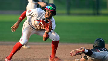 BOURNE   07/13/23   John Spikerman of Falmouth dives safely into second as Josh Kuroda-Grauer of Bourne takes the throw.