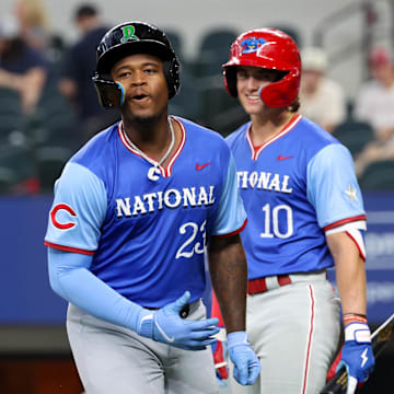 Jul 13, 2024; Arlington, TX, USA;  National League Future infielder Cam Collier (23) reacts in fron tof National League Future  infielder Aidan Miller (10) after hitting a home run during the third inning against the National League Future team during the Major league All-Star Futures game at Globe Life Field.  Mandatory Credit: Kevin Jairaj-Imagn Images