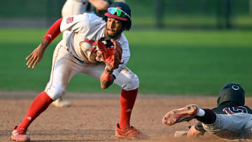 BOURNE   07/13/23   John Spikerman of Falmouth dives safely into second as Josh Kuroda-Grauer of Bourne takes the throw.