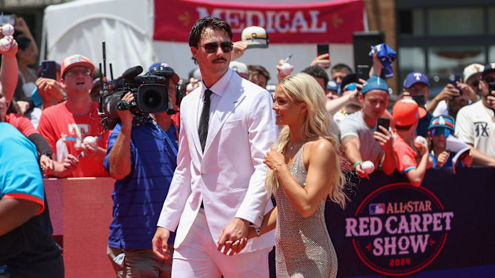 Pittsburgh Pirates pitcher Paul Skenes walks the red carpet with LSU gymnast and girlfriend Livvy Dunne before the 2024 MLB All-Star game at Globe Life Field. Pittsburgh Pirates pitcher Paul Skenes walks the red carpet with LSU gymnast and girlfriend Livvy Dunne before the 2024 MLB All-Star game at Globe Life Field.