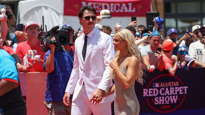 Jul 16, 2024; Arlington, Texas, USA; Pittsburgh Pirates pitcher Paul Skenes walks the red carpet with LSU gymnast and girlfriend Livvy Dunne before the 2024 MLB All-Star game at Globe Life Field. Mandatory Credit: Kevin Jairaj-USA TODAY Sports