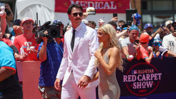 Jul 16, 2024; Arlington, Texas, USA; Pittsburgh Pirates pitcher Paul Skenes walks the red carpet with LSU gymnast and girlfriend Livvy Dunne before the 2024 MLB All-Star game at Globe Life Field. Mandatory Credit: Kevin Jairaj-USA TODAY Sports