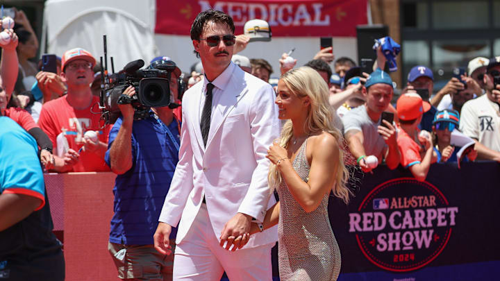 Jul 16, 2024; Arlington, Texas, USA; Pittsburgh Pirates pitcher Paul Skenes walks the red carpet with LSU gymnast and girlfriend Livvy Dunne before the 2024 MLB All-Star game at Globe Life Field. Mandatory Credit: Kevin Jairaj-Imagn Images Jul 16, 2024; Arlington, Texas, USA; Pittsburgh Pirates pitcher Paul Skenes walks the red carpet with LSU gymnast and girlfriend Livvy Dunne before the 2024 MLB All-Star game at Globe Life Field. Mandatory Credit: Kevin Jairaj-Imagn Images