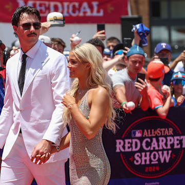 Jul 16, 2024; Arlington, Texas, USA; Pittsburgh Pirates pitcher Paul Skenes walks the red carpet with LSU gymnast and girlfriend Livvy Dunne before the 2024 MLB All-Star game at Globe Life Field. Mandatory Credit: Kevin Jairaj-Imagn Images