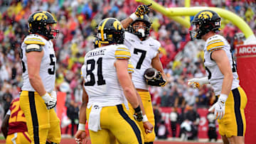 Nov 15, 2025; Los Angeles, California, USA; Iowa Hawkeyes wide receiver Dayton Howard (7) celebrates his touchdown scored against the Southern California Trojans during the first half at the Los Angeles Memorial Coliseum. Mandatory Credit: Gary A. Vasquez-Imagn Images
