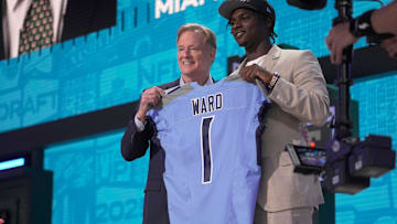 Cam Ward, QB, from Miami holds a jersey with NFL Commissioner Roger Goodell after being selected 1st overall by the Tennessee Titans during the first round of the 2025 NFL Draft at Lambeau Field on April 24, 2025 in Green Bay, Wisconsin.