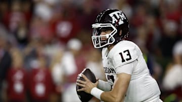 Oct 8, 2022; Tuscaloosa, Alabama, USA;  Texas A&M Aggies quarterback Haynes King (13) rolls out to pass against the Alabama Crimson Tide during the first half at Bryant-Denny Stadium. Mandatory Credit: Butch Dill-Imagn Images