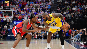 Feb 4, 2025; Inglewood, California, USA; Los Angeles Lakers forward LeBron James (23) controls the ball against Los Angeles Clippers forward Kawhi Leonard (2) during the second half at Intuit Dome. Mandatory Credit: Gary A. Vasquez-Imagn Images