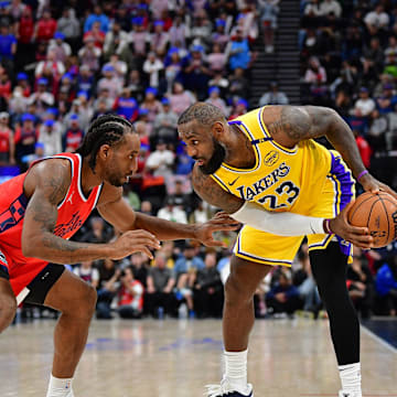 Feb 4, 2025; Inglewood, California, USA; Los Angeles Lakers forward LeBron James (23) controls the ball against Los Angeles Clippers forward Kawhi Leonard (2) during the second half at Intuit Dome. Mandatory Credit: Gary A. Vasquez-Imagn Images