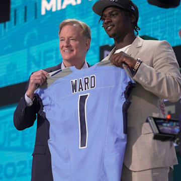 Cam Ward, QB, from Miami holds a jersey with NFL Commissioner Roger Goodell after being selected 1st overall by the Tennessee Titans during the first round of the 2025 NFL Draft.
