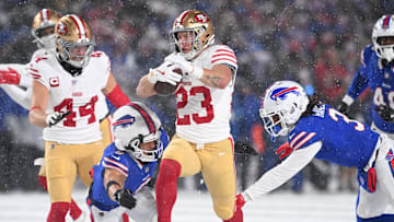 San Francisco 49ers running back Christian McCaffrey is tackled by Buffalo Bills safeties Taylor Rapp and Damar Hamlin