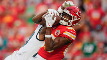 Sep 14, 2025; Kansas City, Missouri, USA; Kansas City Chiefs wide receiver Tyquan Thornton (80) makes a reception for a touchdown defended by Philadelphia Eagles cornerback Quinyon Mitchell (27) during the fourth quarter of the game at GEHA Field at Arrowhead Stadium. Mandatory Credit: Jay Biggerstaff-Imagn Images