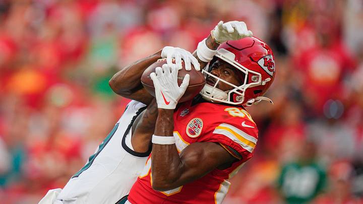 Sep 14, 2025; Kansas City, Missouri, USA; Kansas City Chiefs wide receiver Tyquan Thornton (80) makes a reception for a touchdown defended by Philadelphia Eagles cornerback Quinyon Mitchell (27) during the fourth quarter of the game at GEHA Field at Arrowhead Stadium. Mandatory Credit: Jay Biggerstaff-Imagn Images