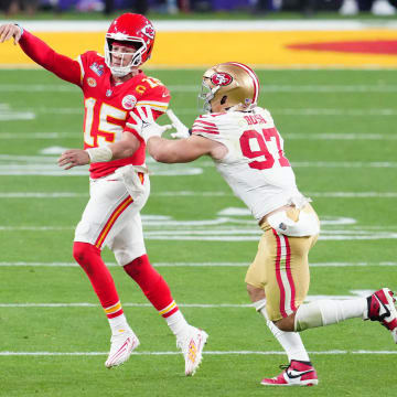 Feb 11, 2024; Paradise, Nevada, USA; Kansas City Chiefs quarterback Patrick Mahomes (15) throws a pass against San Francisco 49ers defensive end Nick Bosa (97) in the second half in Super Bowl LVIII at Allegiant Stadium. Mandatory Credit: Stephen R. Sylvanie-USA TODAY Sports