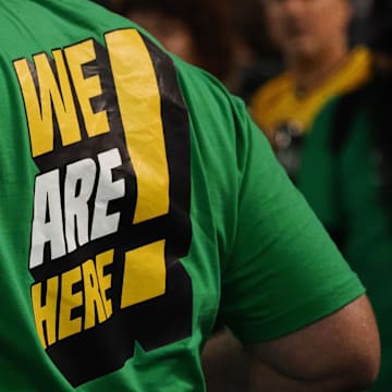 Apr 28, 2023; Oakland, California, USA; An Oakland Athletics fan   s shirt reads    we are here! during the sixth inning against the Cincinnati Reds at Oakland Coliseum. Mandatory Credit: Kelley L Cox-Imagn Images