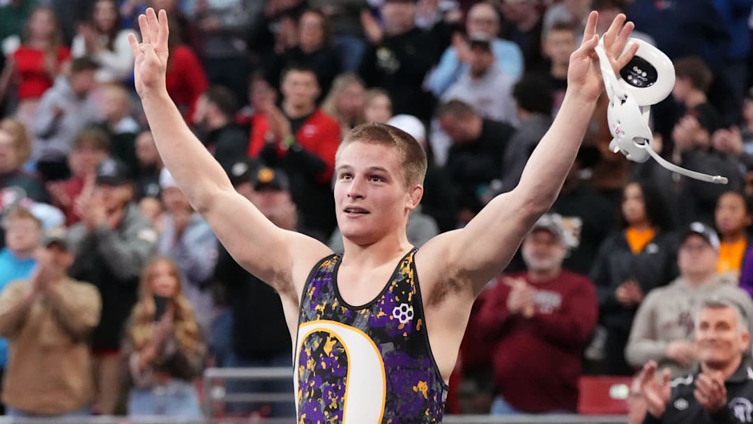 Oconomowoc's Kellen Wolbert waves to fans after winning the Division 1 150-pound championship match during the WIAA state individual wrestling tournament on Feb. 28, 2026.