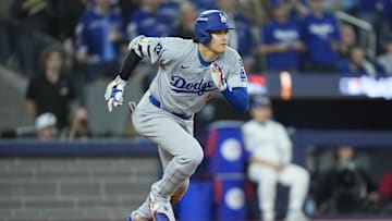 Nov 1, 2025; Toronto, Ontario, CAN; Los Angeles Dodgers two-way player Shohei Ohtani (17) runs to first after hitting a single against the Toronto Blue Jays in the fifth inning during game seven of the 2025 MLB World Series at Rogers Centre. Mandatory Credit: John E. Sokolowski-Imagn Images