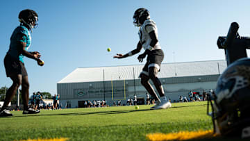 Jacksonville Jaguars wide receiver Brian Thomas Jr. (7) and Jacksonville Jaguars wide receiver Travis Hunter (12) use tennis balls in a drill during an NFL training camp fourth session at the Miller Electric Center, Sunday, July 27, 2025, in Jacksonville, Fla. 