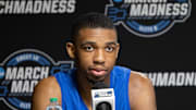 Mar 27, 2025; Indianapolis, IN, USA; Kentucky Wildcats guard Lamont Butler (1)  talks to the media during practice day at Lucas Oil Stadium. Mandatory Credit: Trevor Ruszkowski-Imagn Images