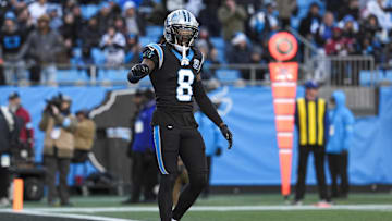 Dec 22, 2024; Charlotte, North Carolina, USA; Carolina Panthers cornerback Jaycee Horn (8) questions a call by the official  during the second half against the Arizona Cardinals at Bank of America Stadium. Mandatory Credit: Jim Dedmon-Imagn Images
