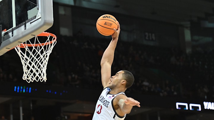 Mar 24, 2024; Spokane, WA, USA; San Diego State Aztecs forward Jaedon LeDee (13) dunks the ball in the second half against the Yale Bulldogs at Spokane Veterans Memorial Arena. Mandatory Credit: James Snook-Imagn Images