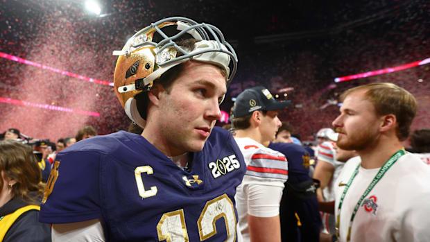 Notre Dame Fighting Irish quarterback Riley Leonard (13) reacts after losing the CFP National Championship college football g