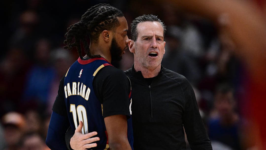 Nov 30, 2025; Cleveland, Ohio, USA; Cleveland Cavaliers head coach Kenny Atkinson talks with Cleveland Cavaliers guard Darius Garland (10) during the second half against the Boston Celtics at Rocket Arena. Mandatory Credit: David Dermer-Imagn Images